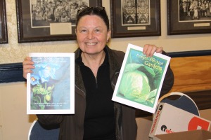 Florence Welsh with copies of her Sitka gardening book