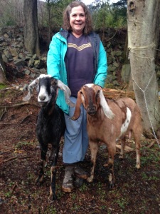 Bobbi Daniels with two goats (Photo courtesy of Lori Adams of Down-To-Earth U-Pick Gardens)